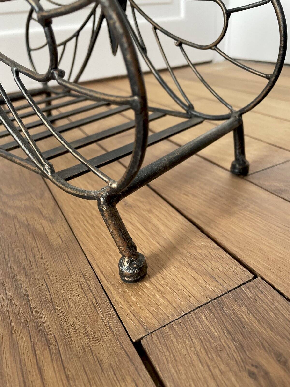 Butterfly magazine rack in patinated metal