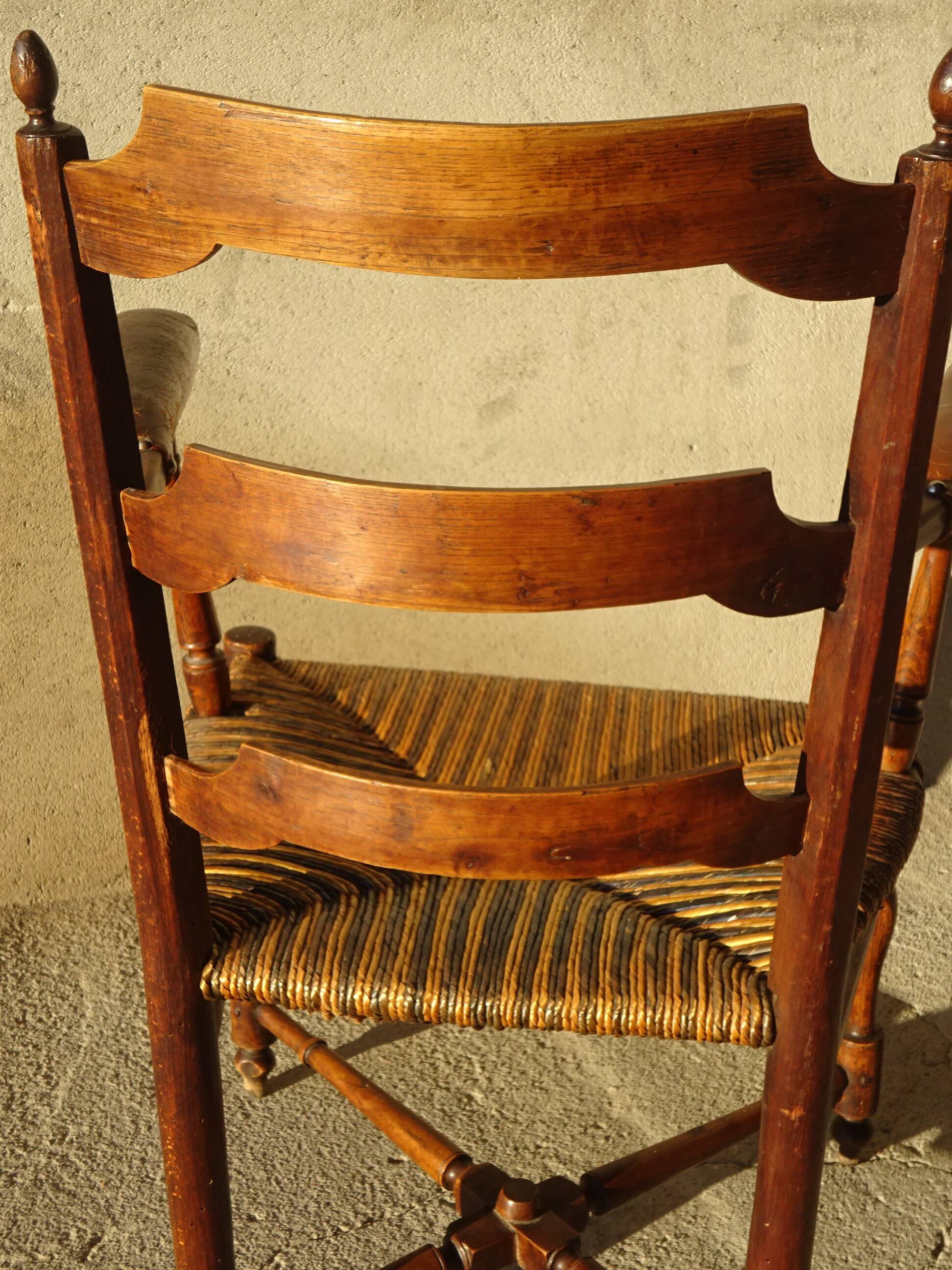 old armchair with leather armrests, from the 19th century
