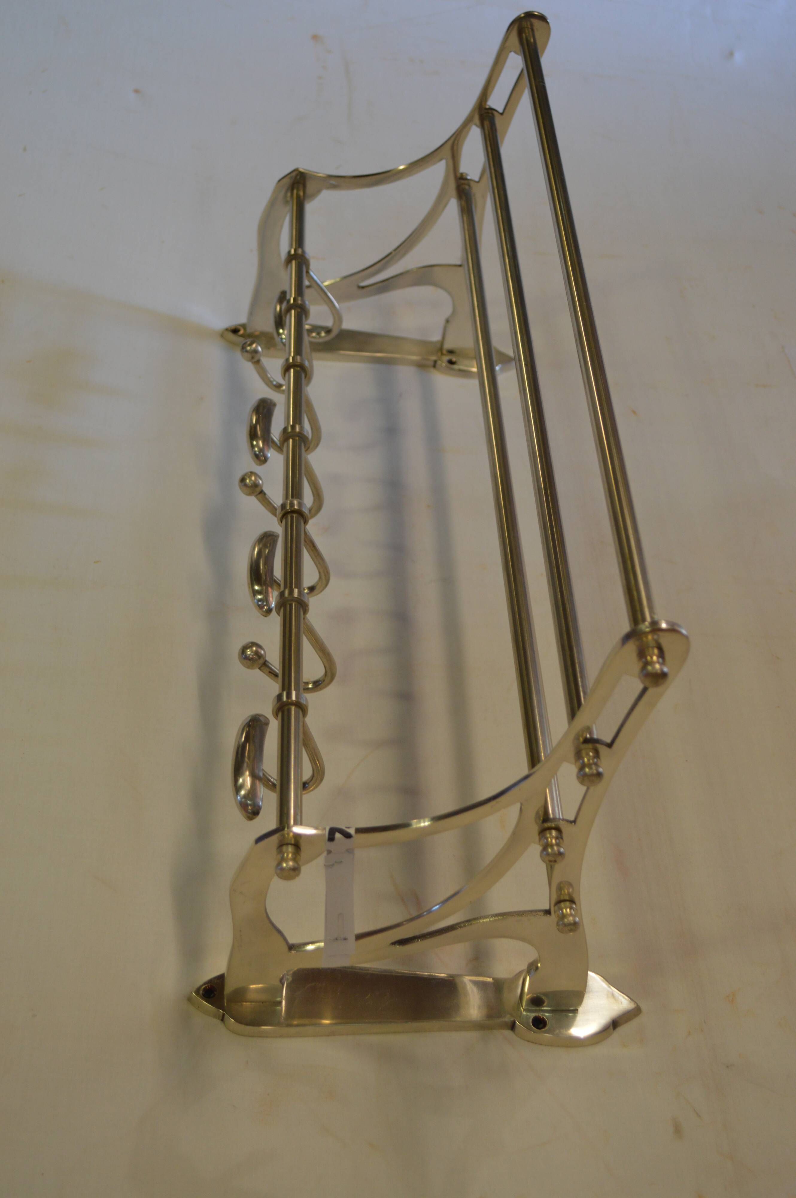 Chrome iron coat holder with a hat holder