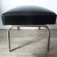 Ottoman foot rest in chrome and black leatherette of the 1950s