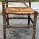 Brutalist corner chair in turned wood with straw bobbins, 1960.