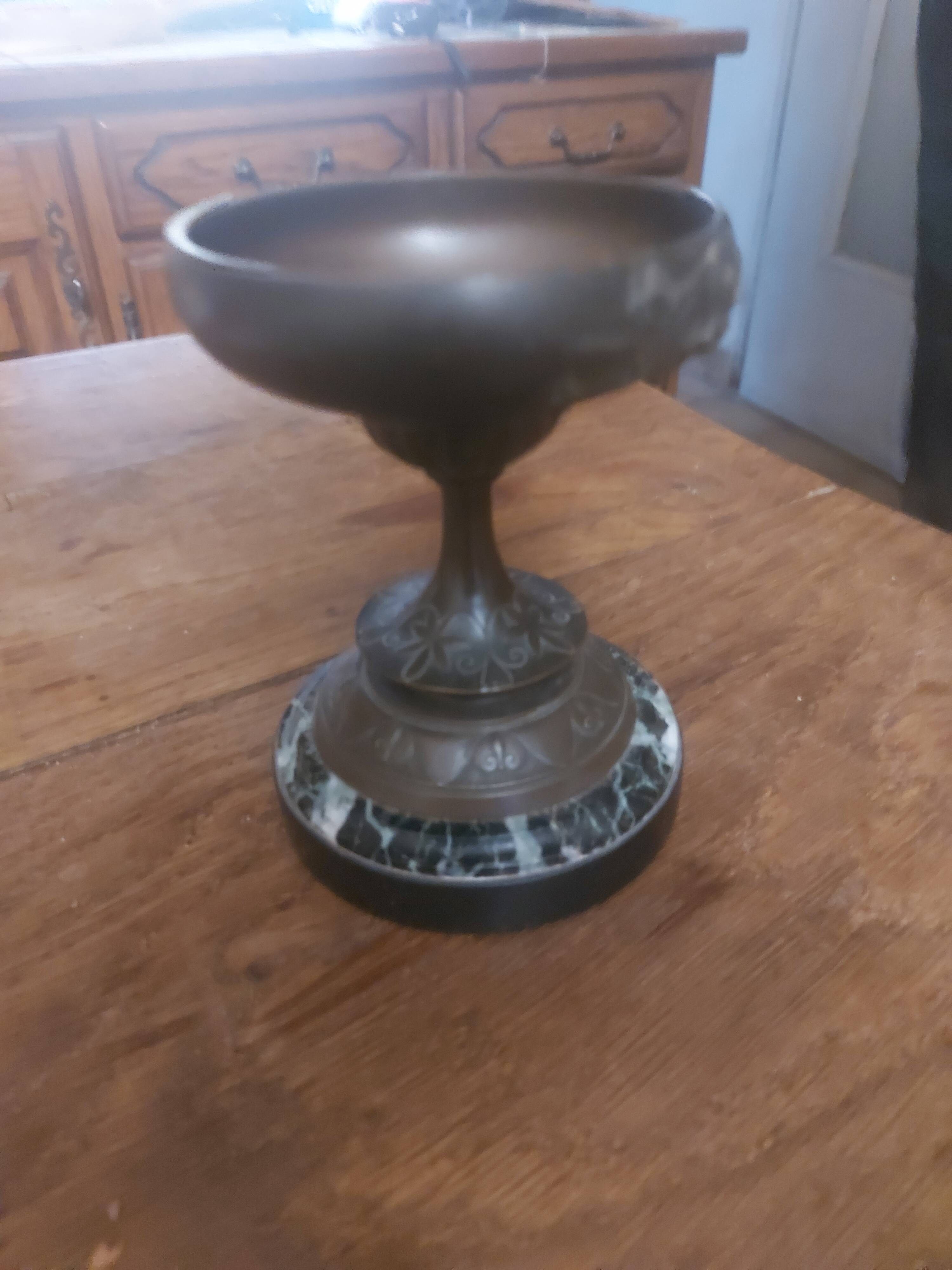 Bronze bowl on marble base