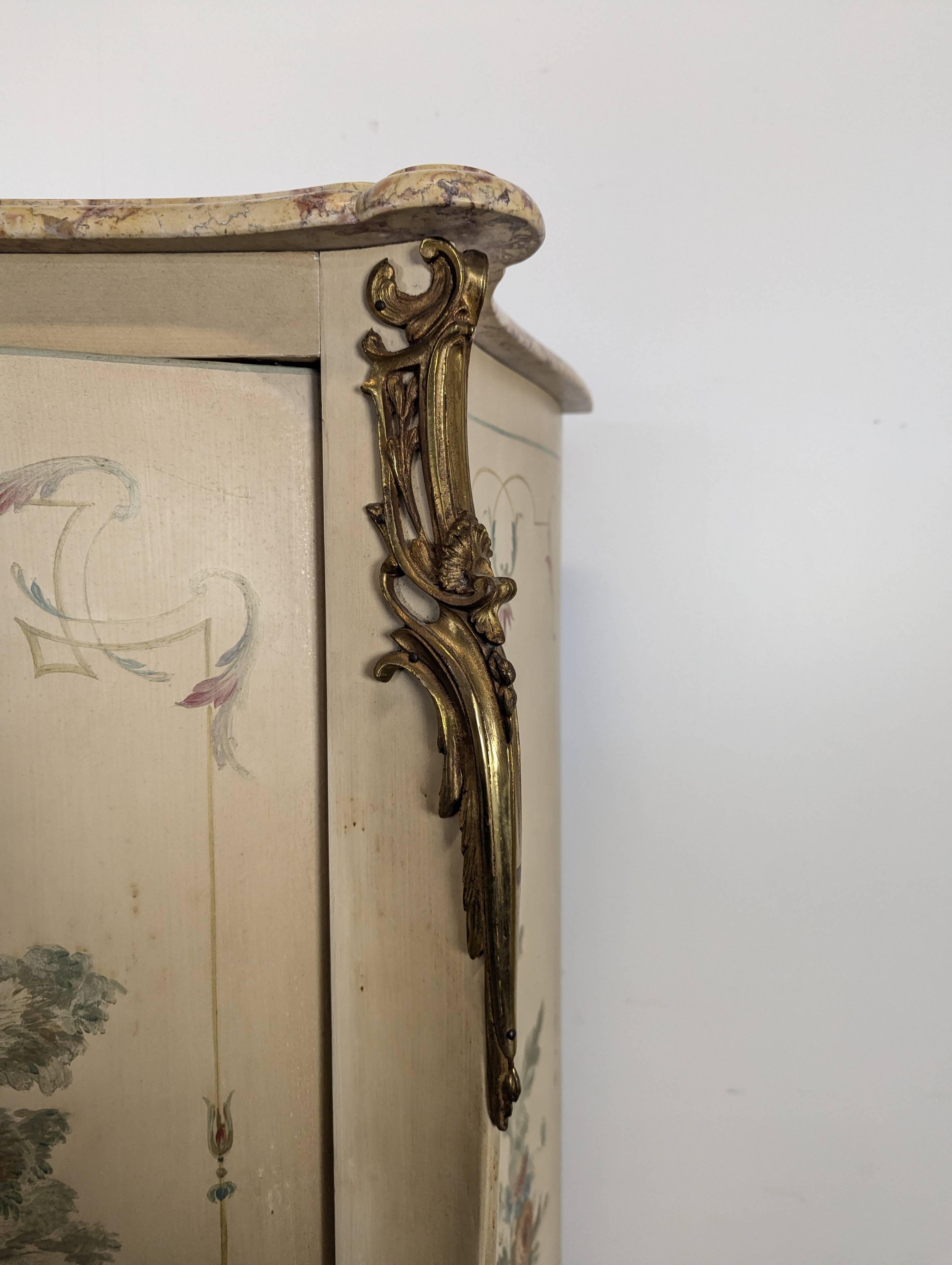 Louis XV style wardrobe with decorations of gallant scenes.