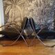 Pair of chrome and faux leather armchairs