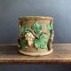 Large 19th century slip pot with vine decoration