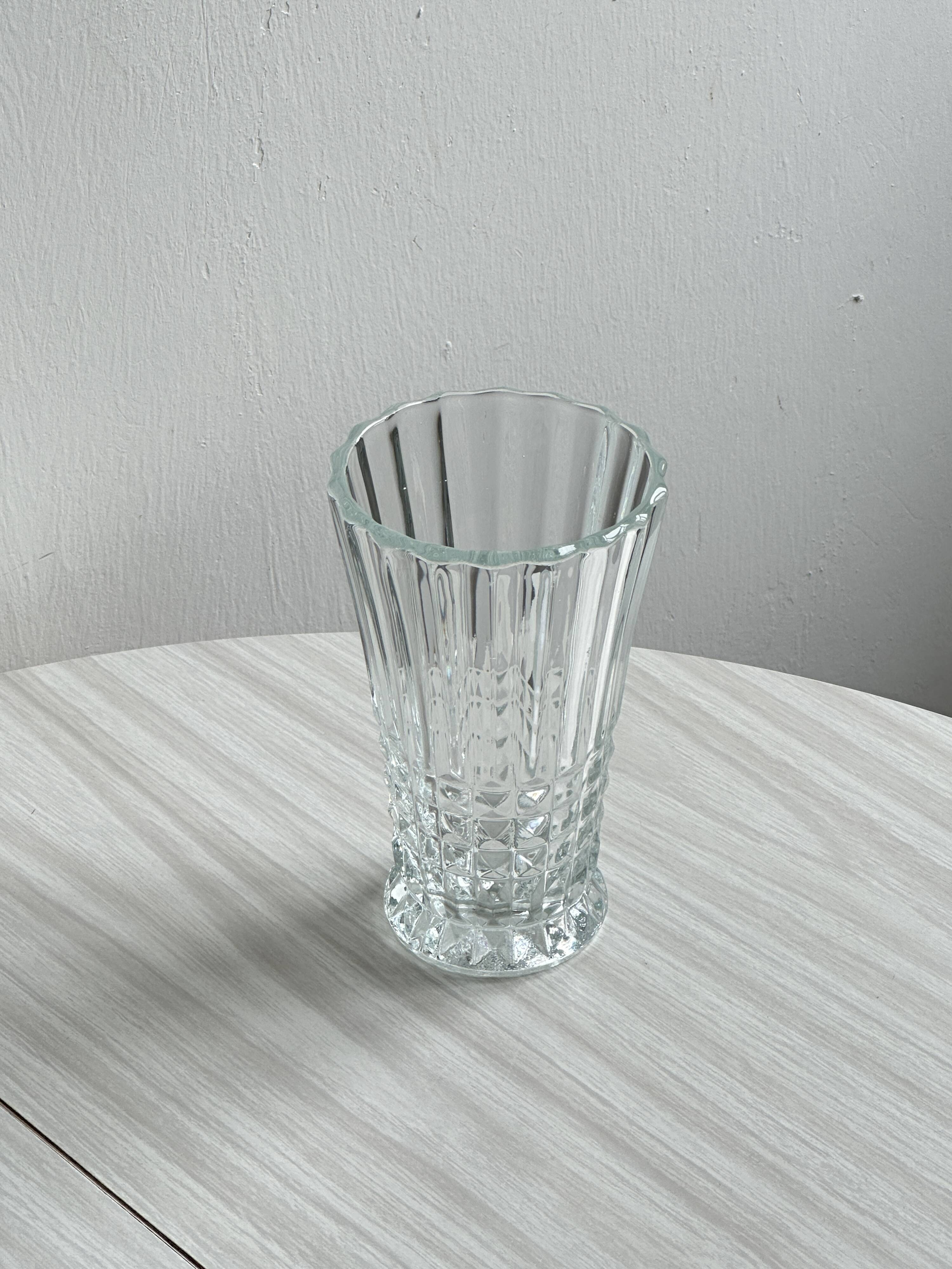 Diamond point molded thick glass vase.