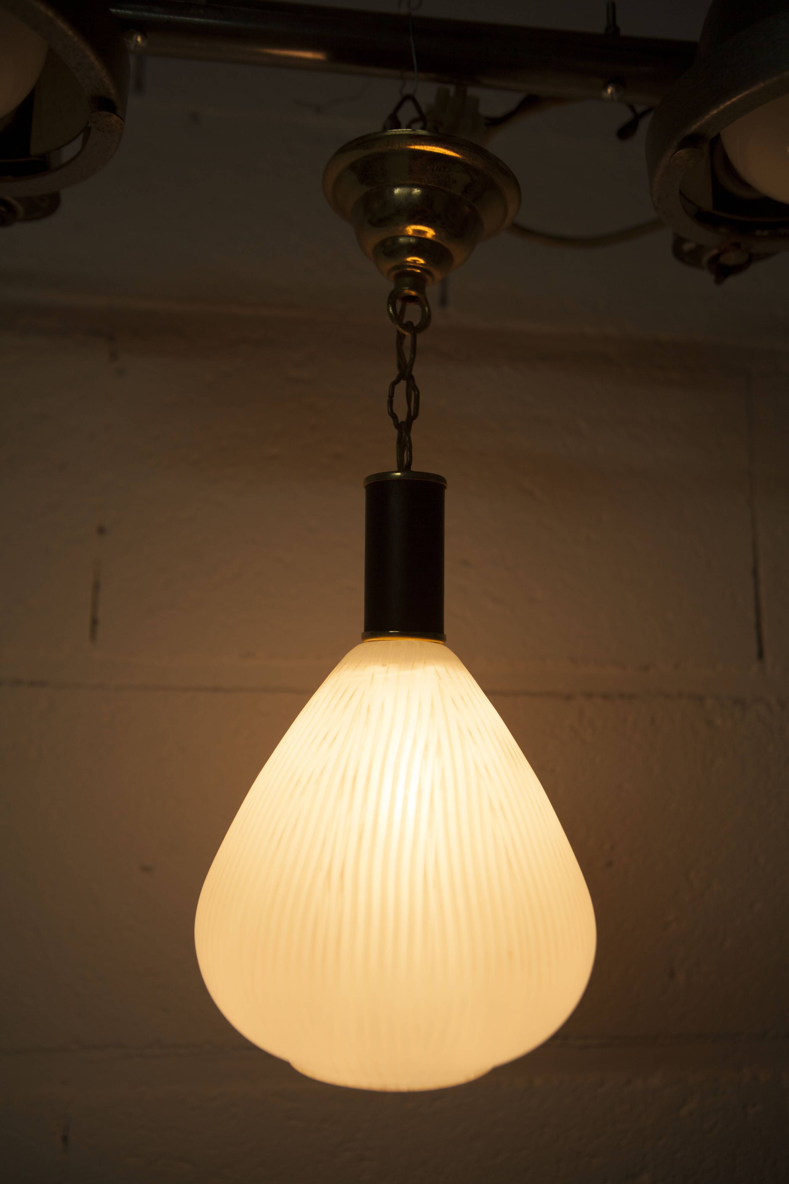 Mid-century suspension, brass, striped glass.