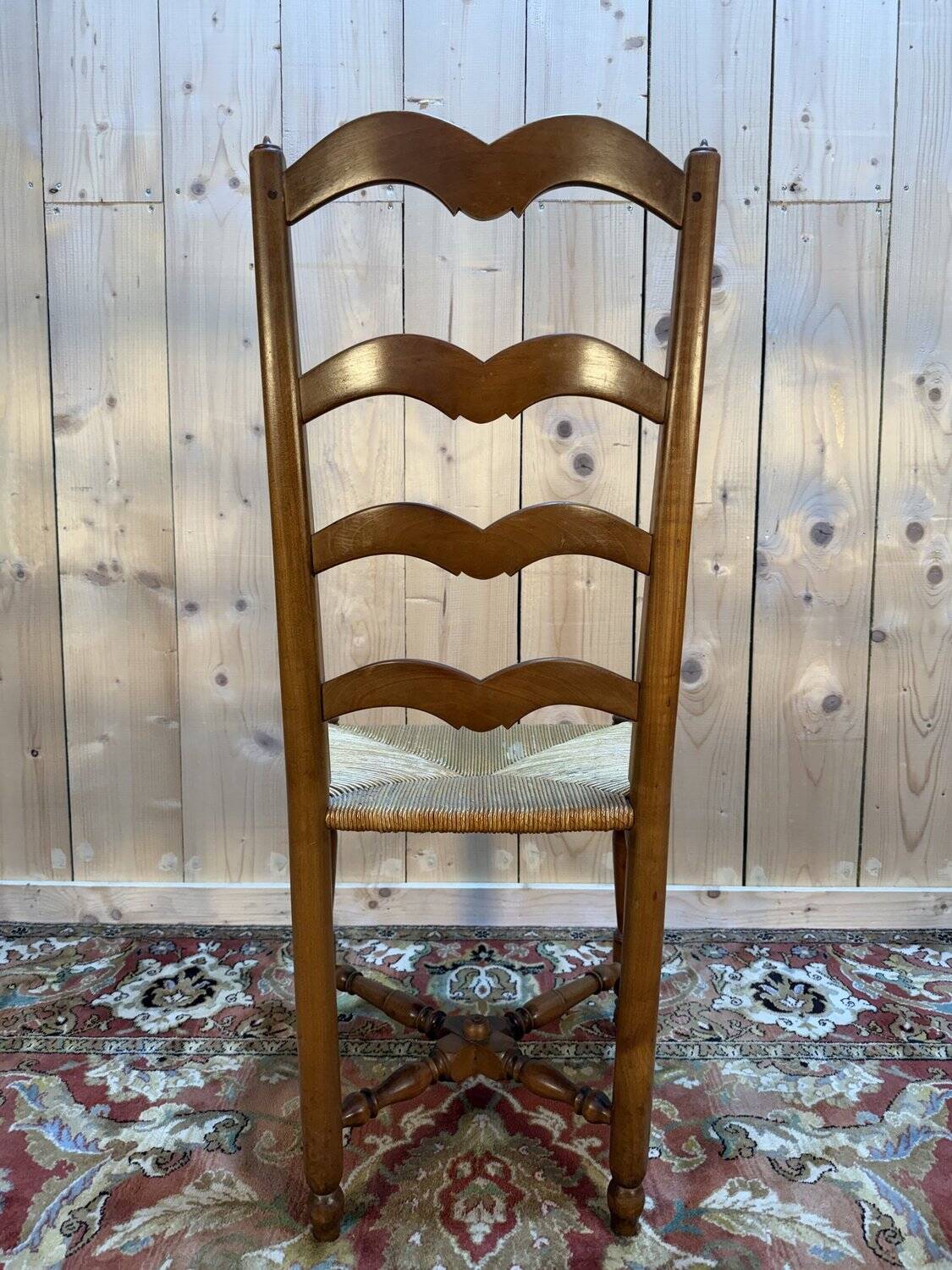 Set of 8 rustic high-back straw chairs.