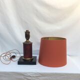 Brass lamp surrounded by leather with lampshade