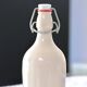 Antique enamelled stoneware beer bottle signed MKM