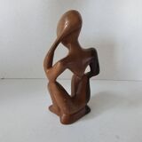 Wooden statuette sculpture of a thinking man design