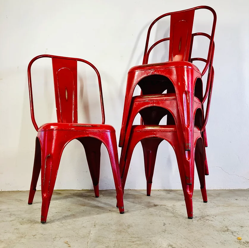 Set of four low chairs in red steel