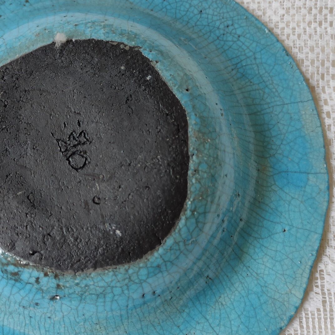 Empty turquoise raku pocket