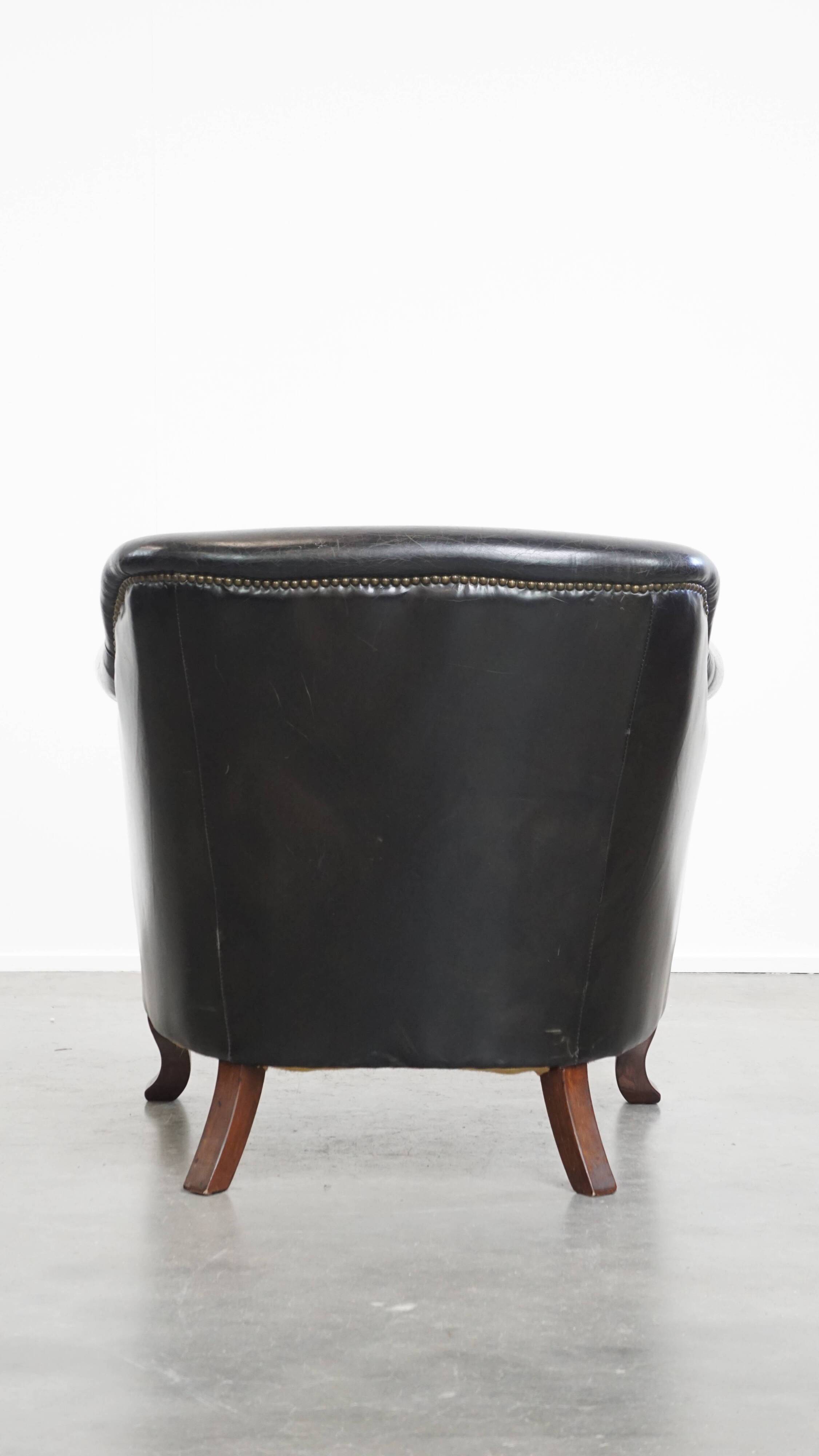 Black cowhide leather armchair