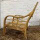 Fauteuil chauffeuse vintage en rotin des années 70