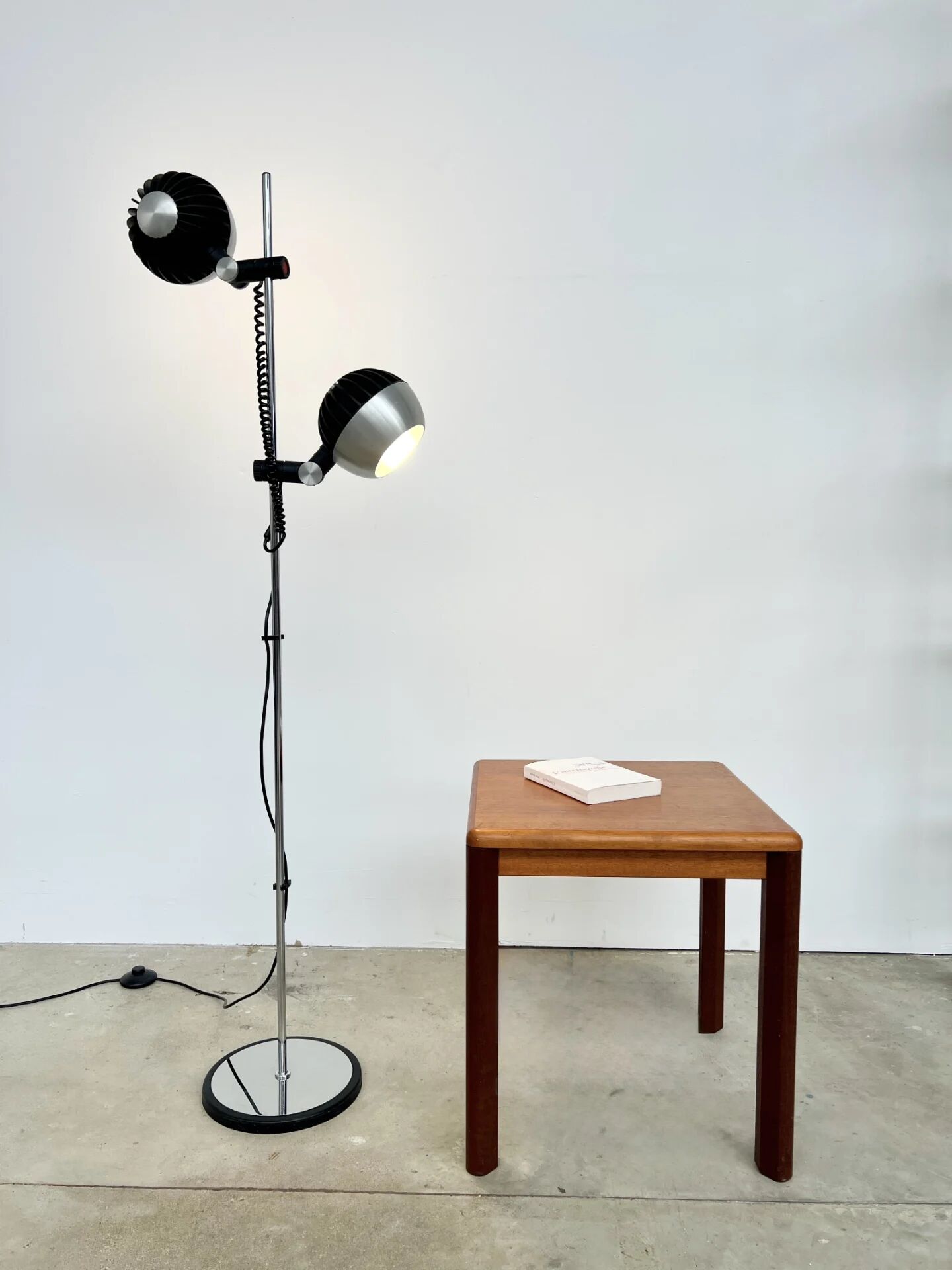 Two-spot floor lamp phase — brushed steel and matte black — 1970s