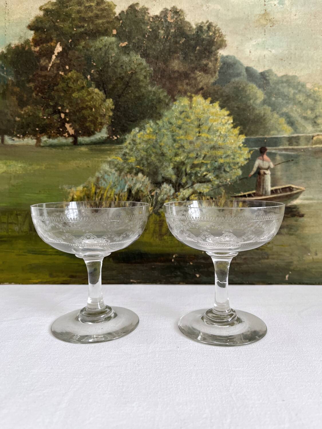 2 antique champagne glasses in engraved glass