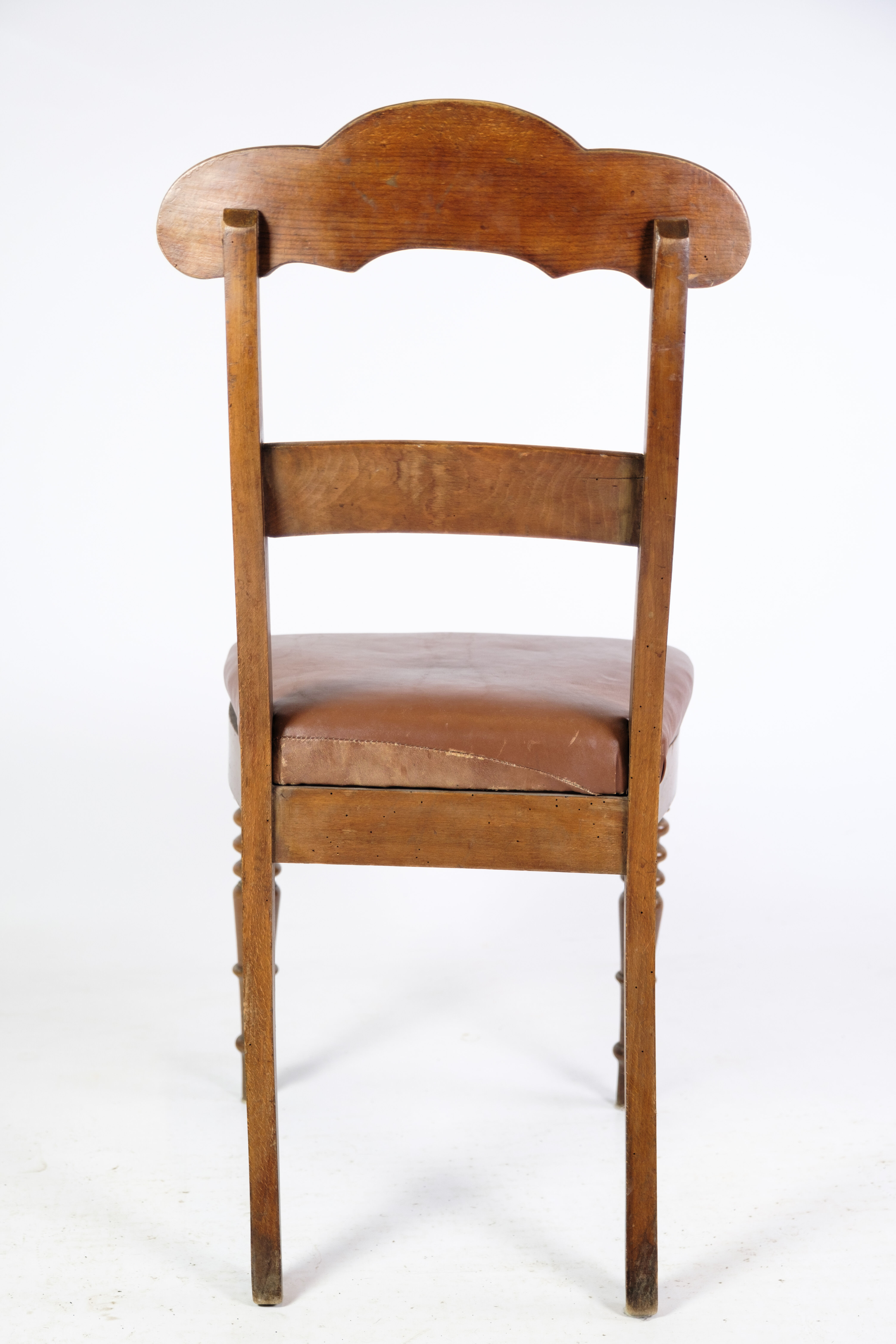 Set of eight late empire chairs in high quality brown leather in mahogany