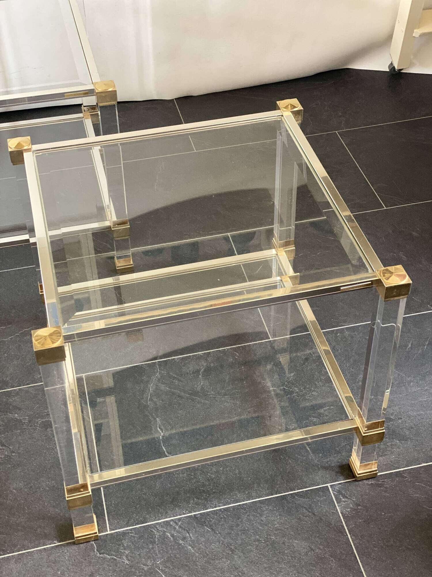 Pair of vintage and brass glass hollywood regency side tables by peter vandel
