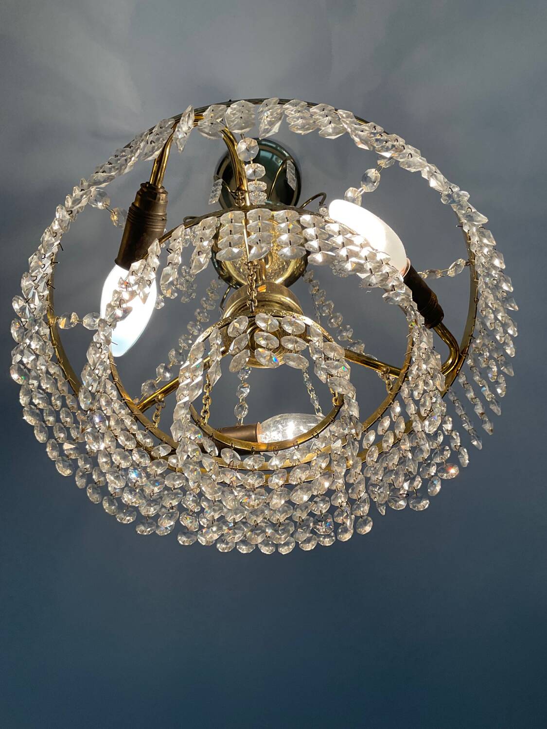 Cascade chandelier with crystal and brass tassels
