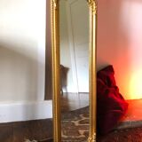 Old slim golden mirror