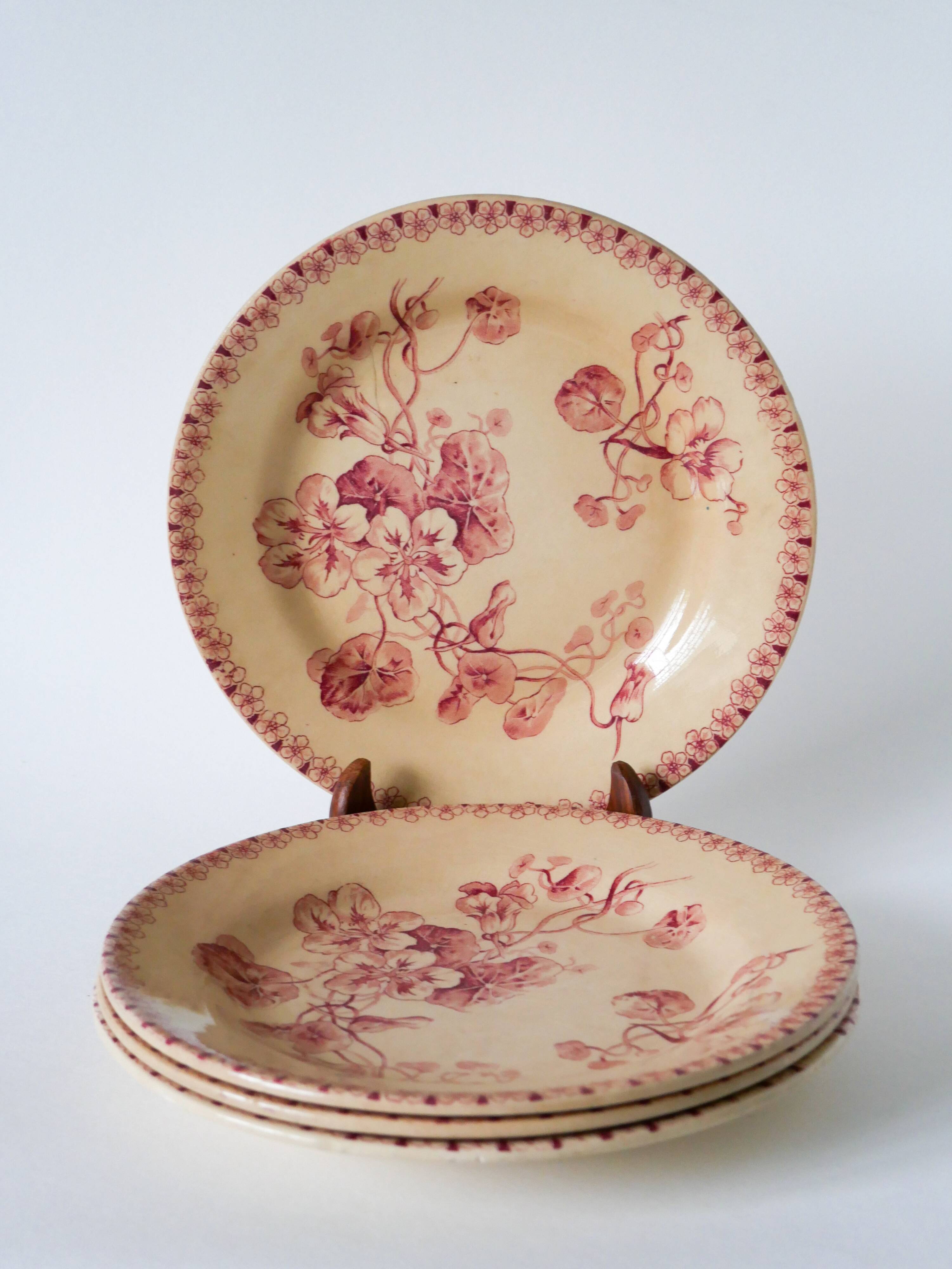 Set of 4 flat plates in Iron Earth, Gien "Capucines" model, late 19th century