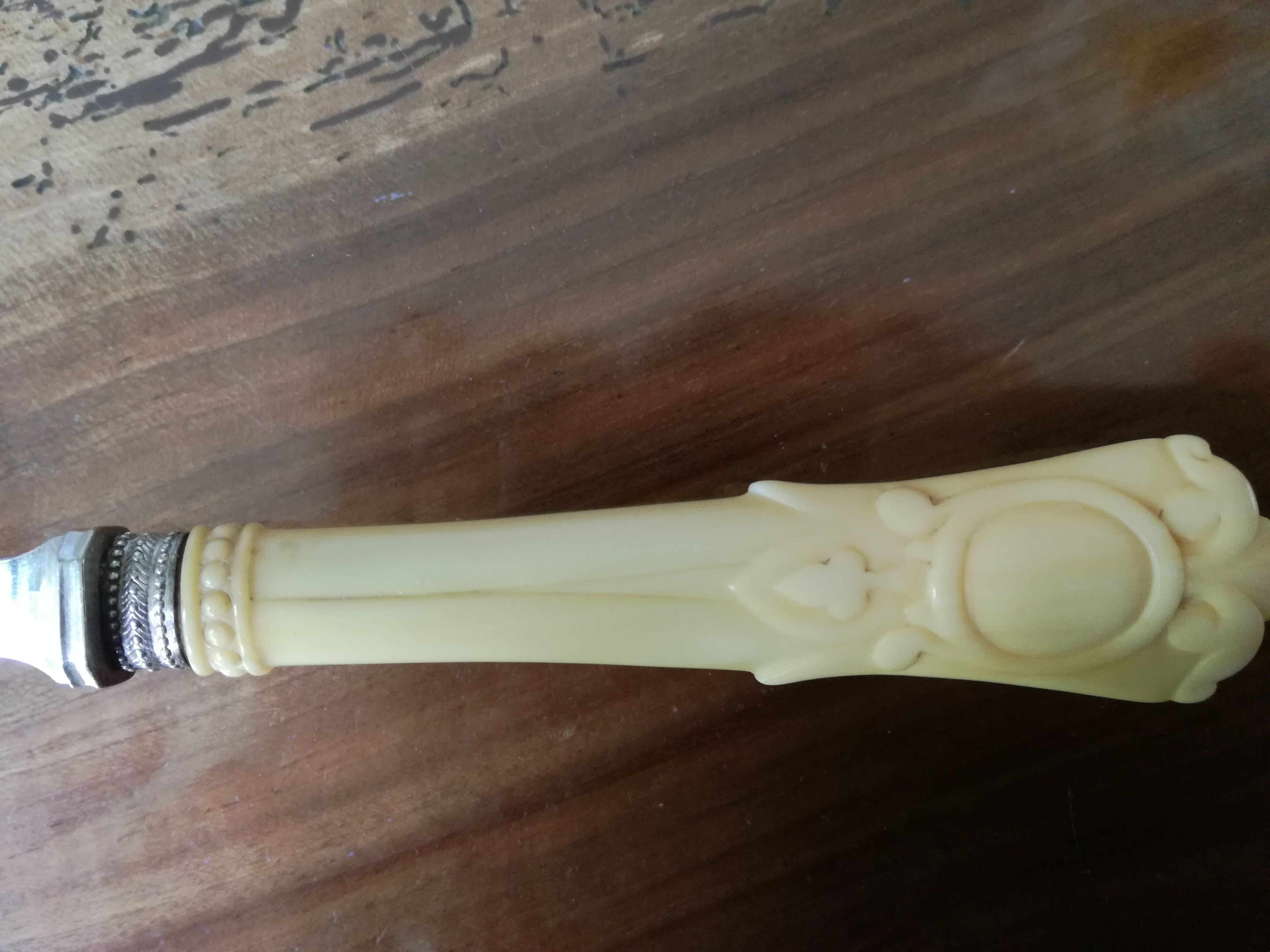 Silver and ivory paper cut