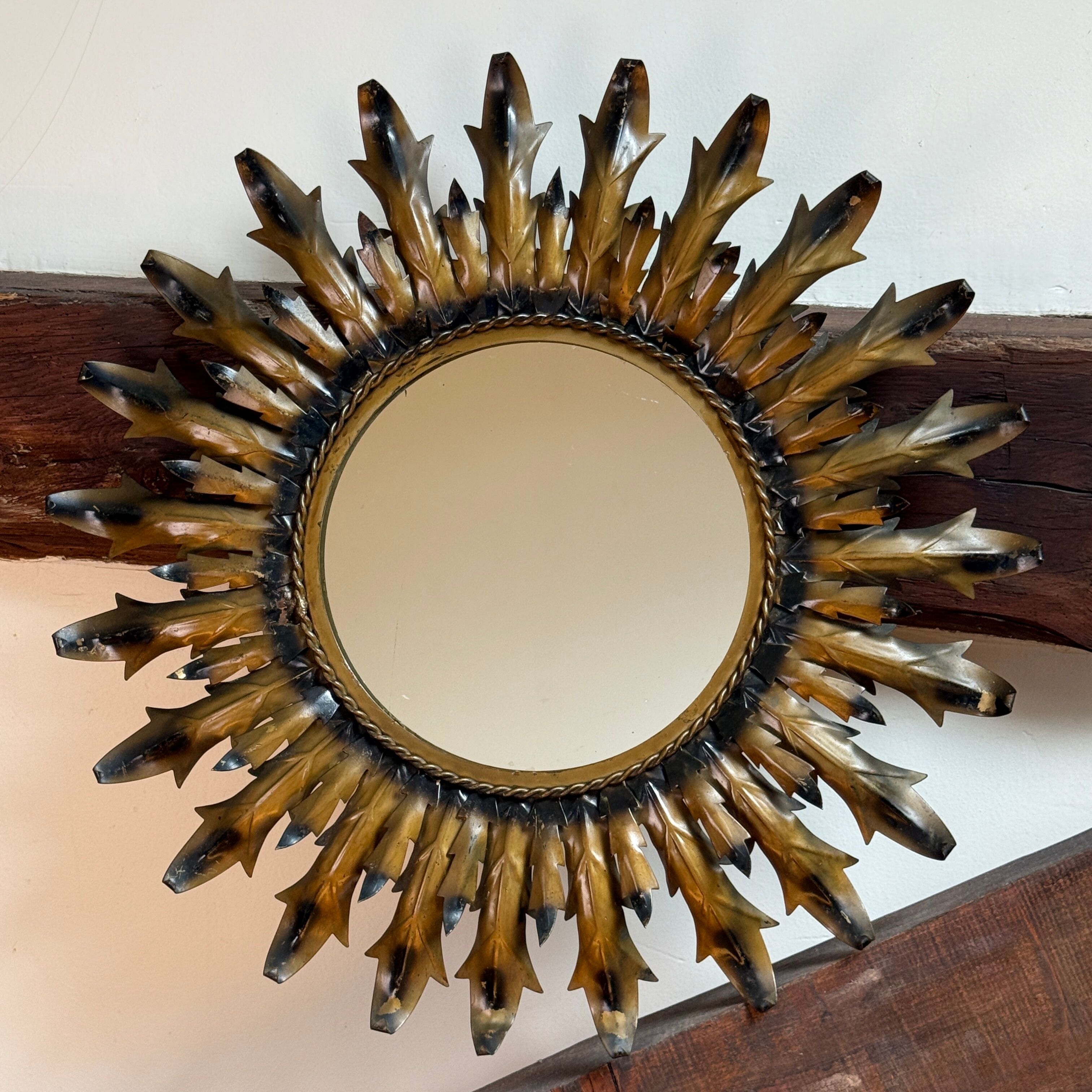 Sun mirror in wrought iron from the 1950s Italy.