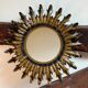 Sun mirror in wrought iron from the 1950s Italy.
