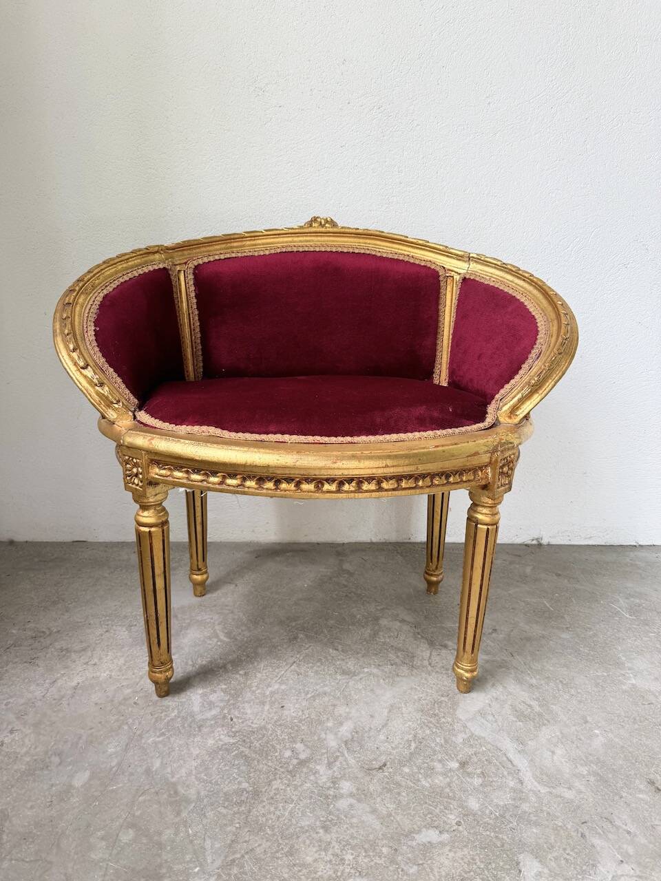 Louis XVI gilt wood and red velvet armchair