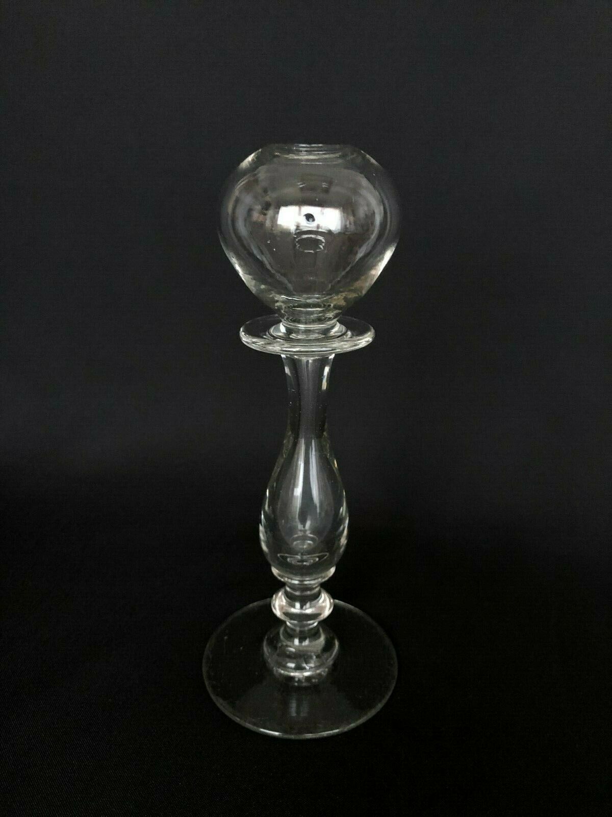 Glass oil lamp blows on foot shower