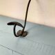 Antique coat rack with red wooden ball