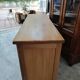 Low sideboard in light solid oak with 3 doors and 1 drawer.