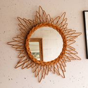 Vintage sun mirror in woven rattan