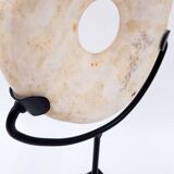 "Wamayuwa" Boiken coin in hand-carved shell mounted on a black metal stand