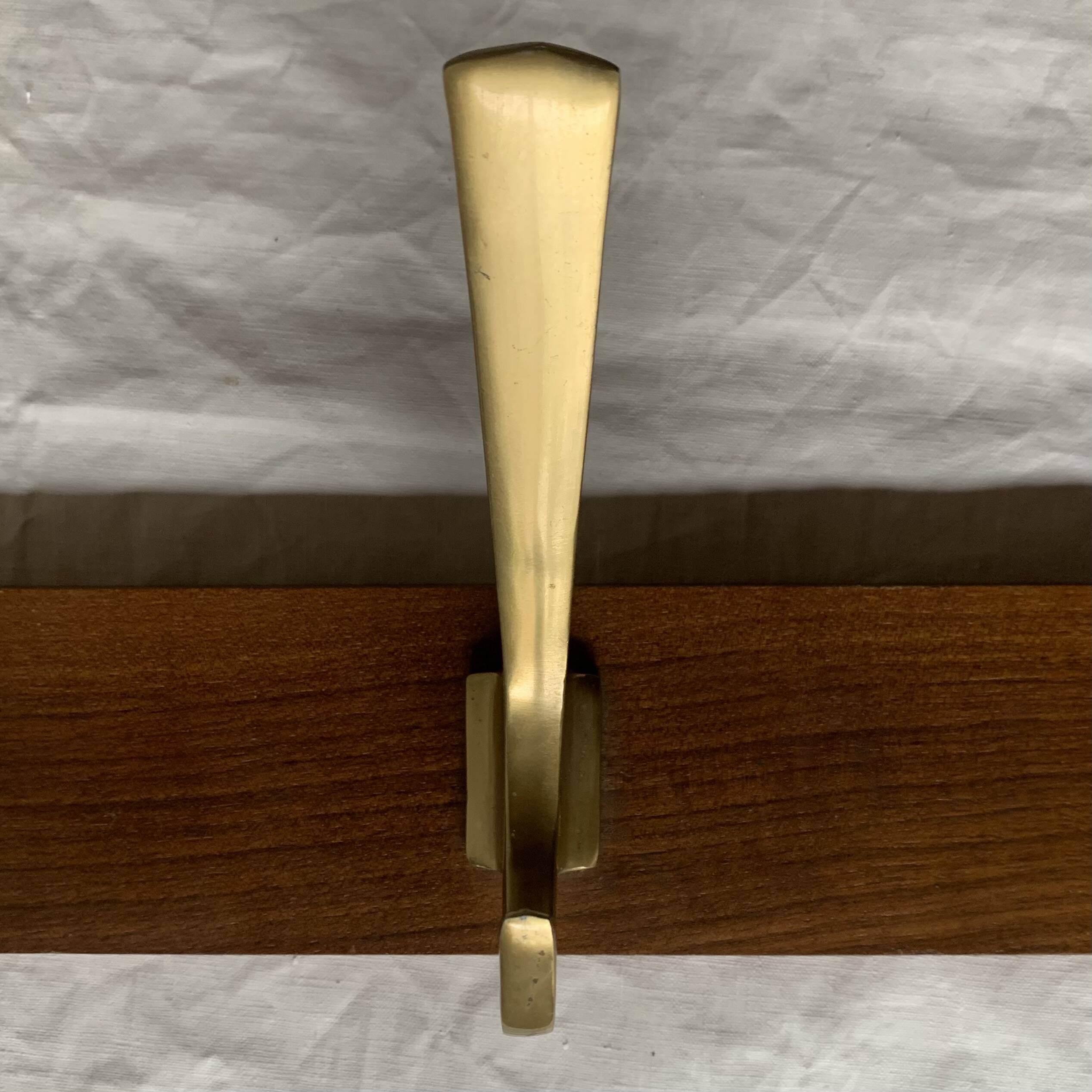 Vintage wooden wall-mounted coat rack with 3 golden cast aluminum hooks