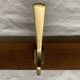 Vintage wooden wall-mounted coat rack with 3 golden cast aluminum hooks