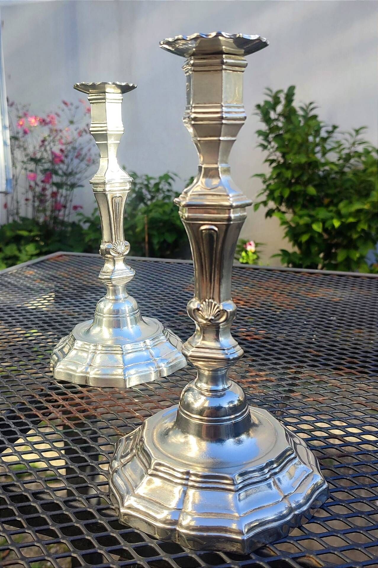 Magnificent pair of silver candlesticks.