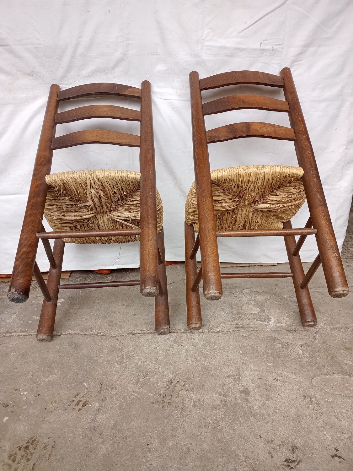 Brutalist chairs in walnut and straw