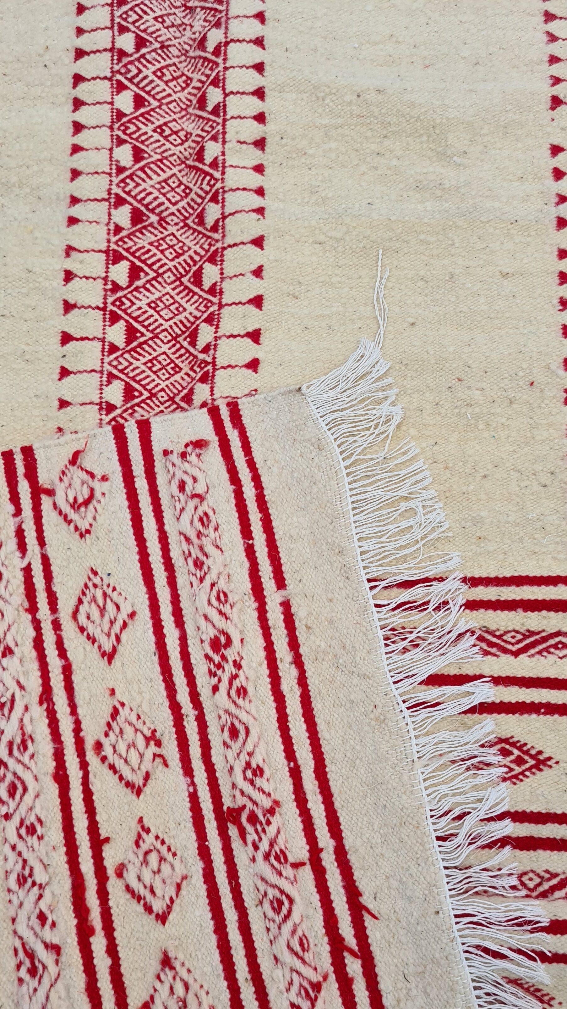 Traditional ethnic-patterned red and white carpet