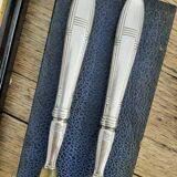 Corn and silver metal salad cutlery