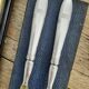 Corn and silver metal salad cutlery