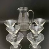 Glass and carafe set with chiseled flower motif