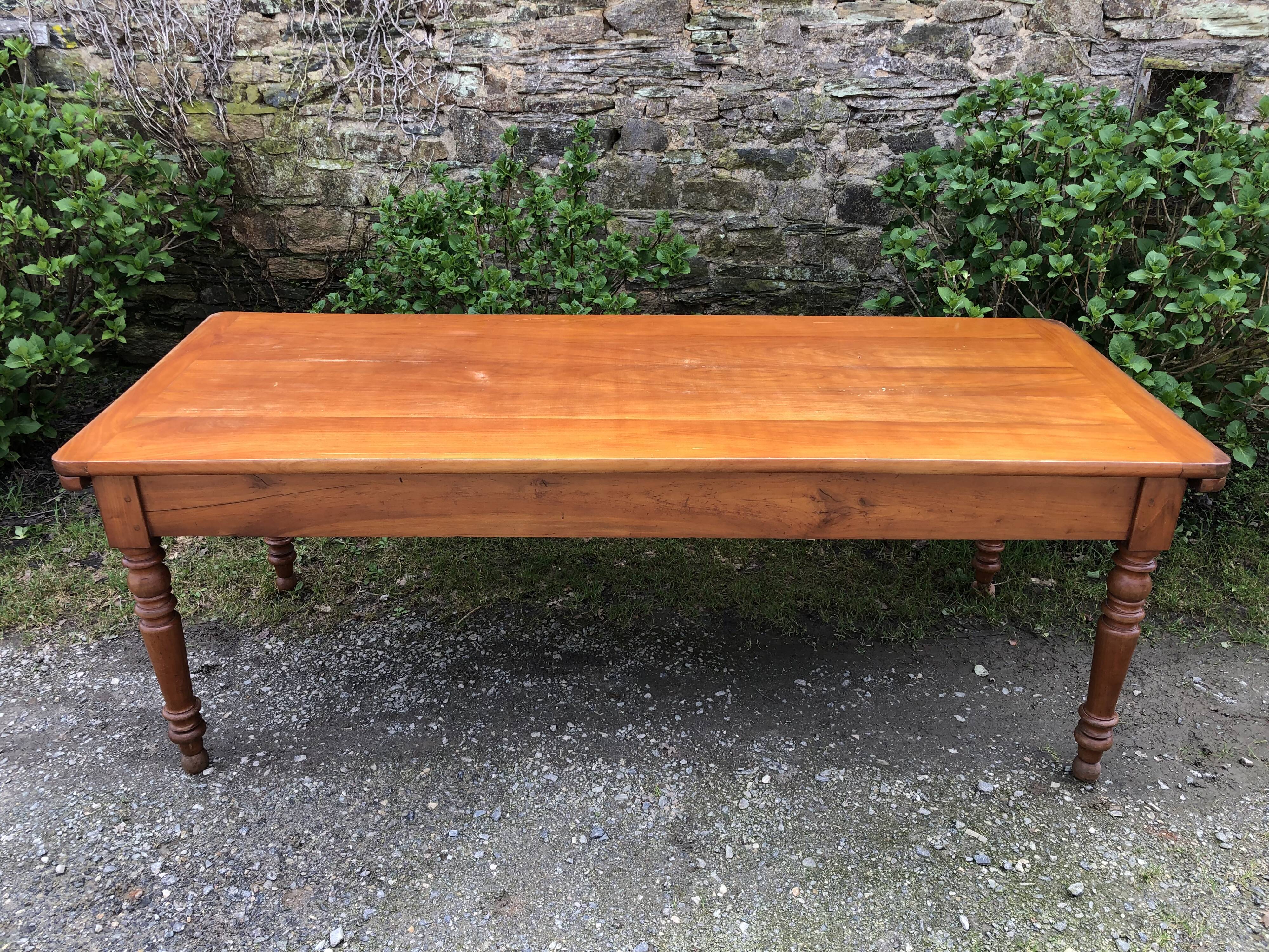 Antique Louis Philippe style farmhouse table in solid cherry wood with its 2 extensions.