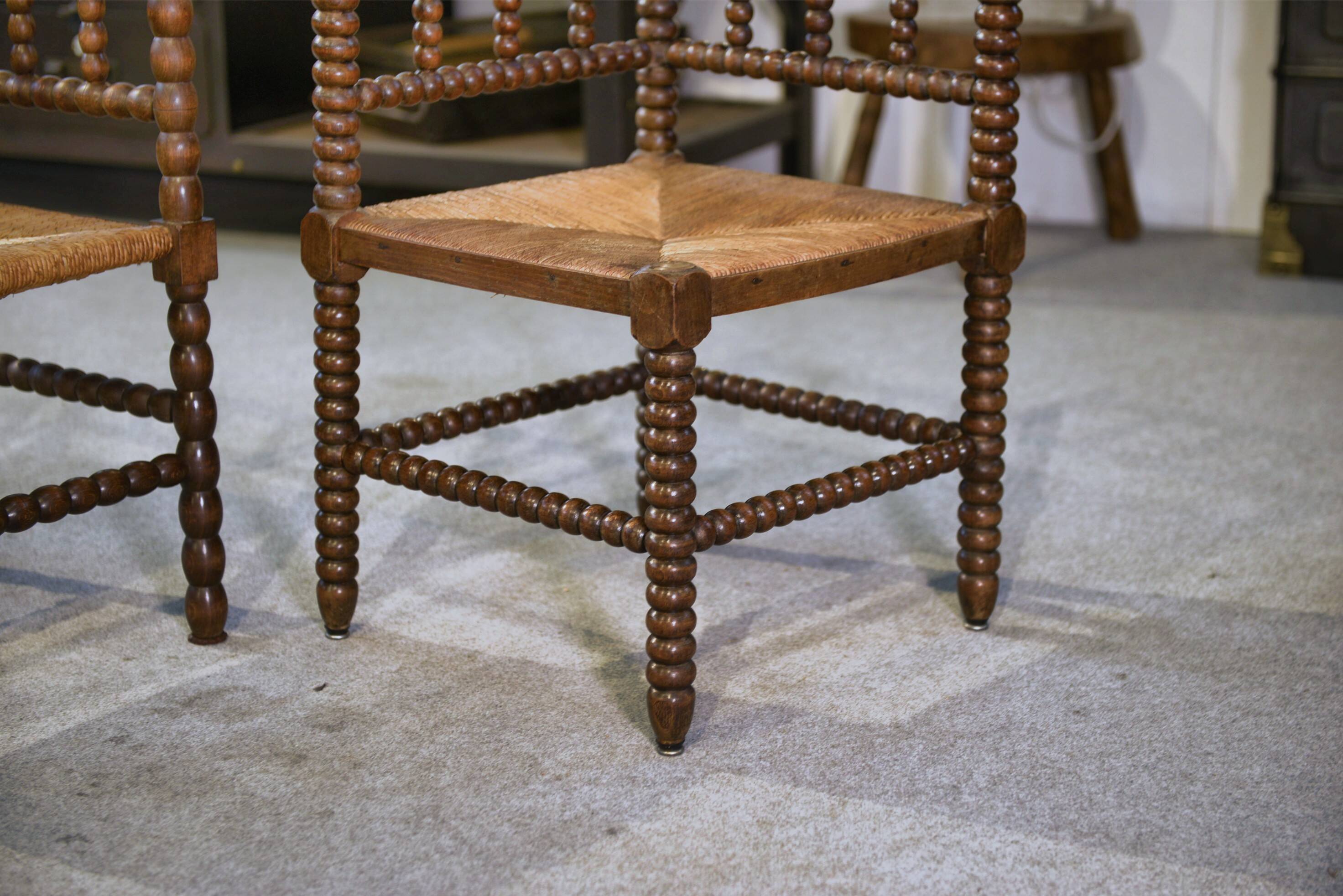 Pair of turned wooden corner chairs from the 1950s.