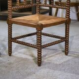 Pair of turned wooden corner chairs from the 1950s.