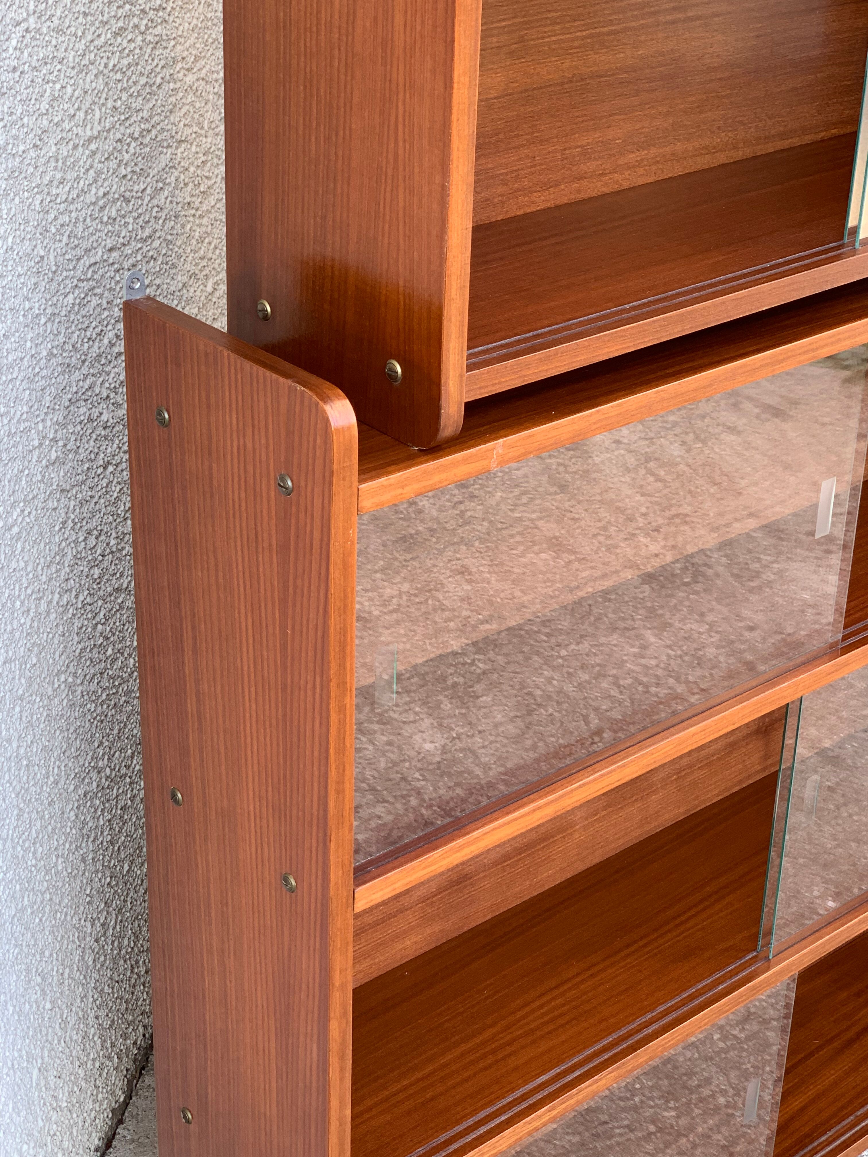glass wall bookcase in vintage teak 1950