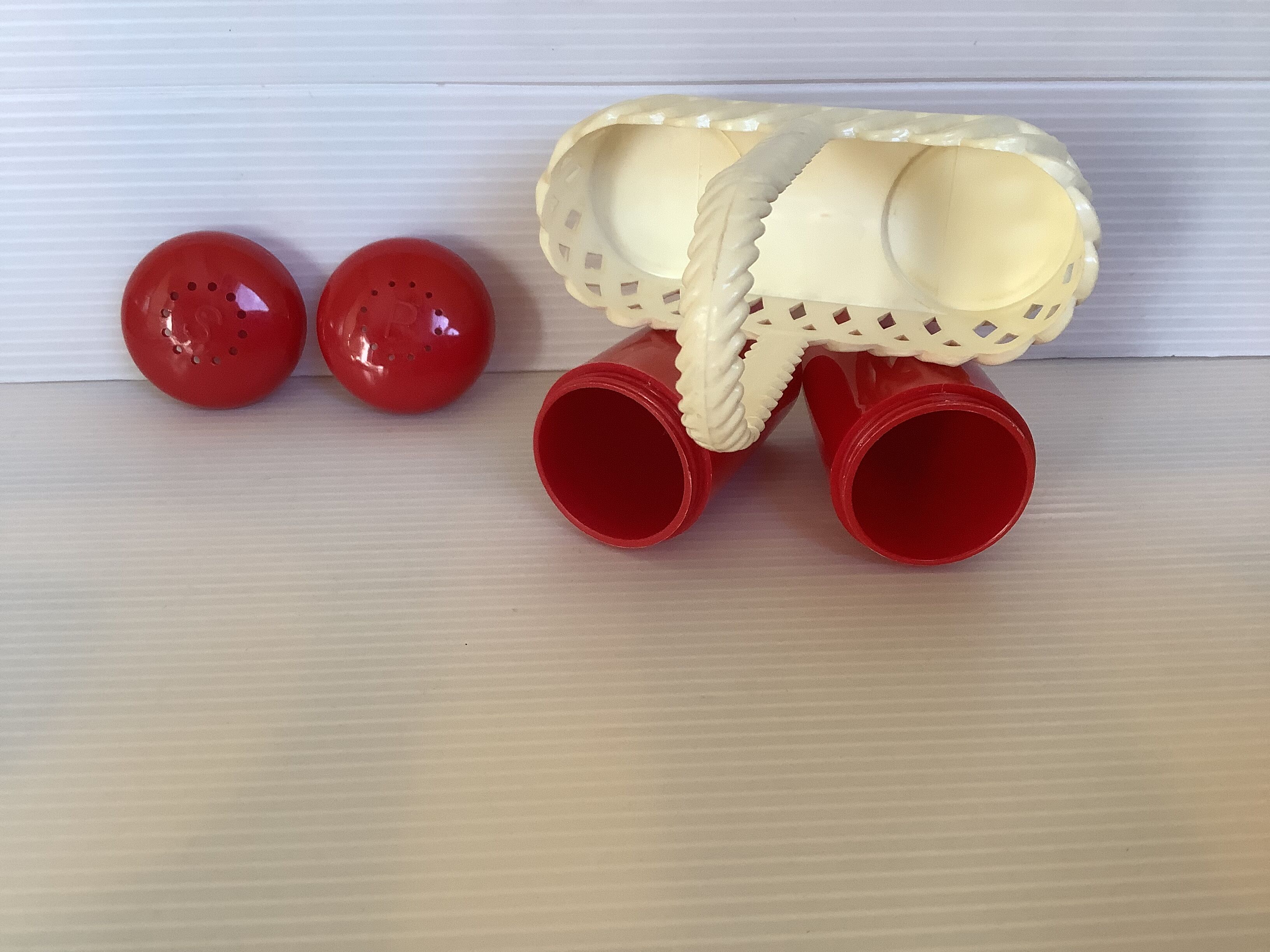 Red and white plastic salt and pepper shakers Emsa.