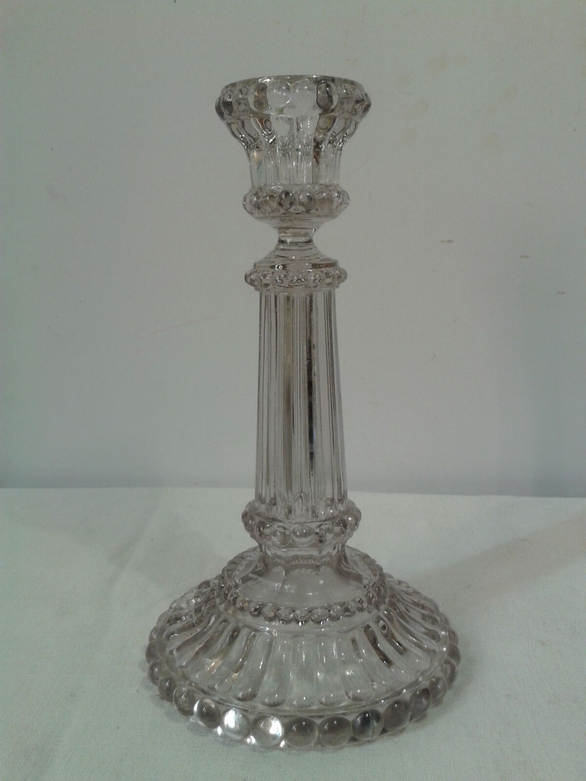 Former candlestick in press-molded glass late 19th