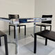 Smoked glass dining table with chrome legs, 1970s design by Roche Bobois.